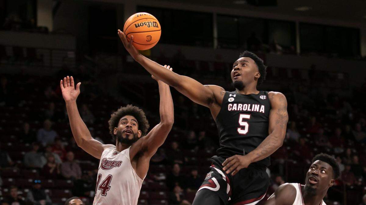 Jermaine Couisnard goes up for a layup between Dimencio Vaughn (left) and Ajiri Ogemuno-Johnson of Rider University during the Gamecocks’ game against the visiting Broncs at Colonial Life Arena on Sunday, November 28, 2021.