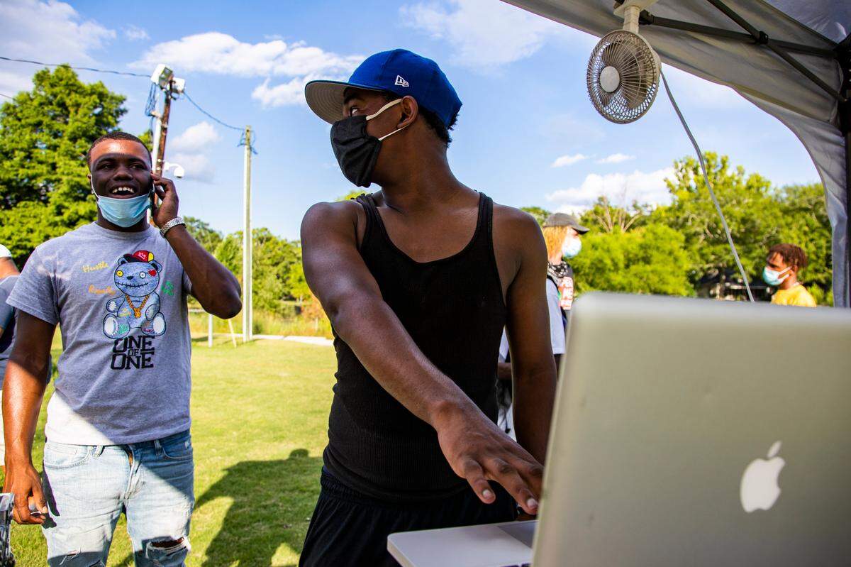 Jonathan Brown and Moon Global talk and DJ for a Juneteenth gathering at Martin Luther King Park on Saturday, June 20, 2020. Local musicians and the Party for Socialism and Liberation organized the celebration with free food and live DJ sets.