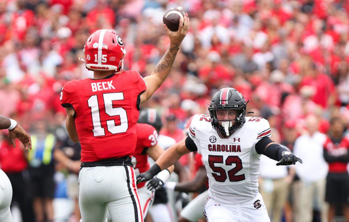 South Carolina linebacker Stone Blanton (52) pressures Georgia quarterback Carson Beck (15) during the first half of the Gamecocks’ game at Sanford Stadium in Athens on Saturday, September 16, 2023.