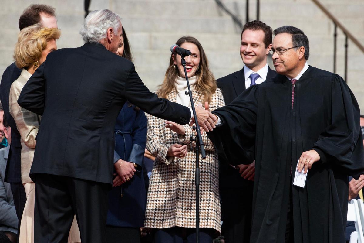 South Carolina governor Henry McMaster shakes South Carolina Supreme Court justice John Kittredge after being sworn in for a second term during an inauguration at the South Carolina State House on Wednesday, January 11, 2023.
