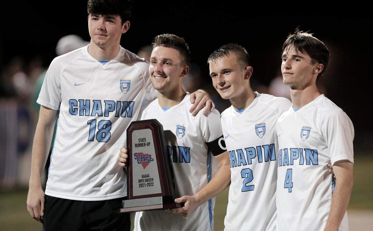 Chapin’s Steven Jackson, Arlis Dawsey, Thomas Holstein and Wilson Overstreet accept the runner-up trophy after the 2022 Class 5A boys soccer state championship Saturday against Riverside in a match played at Irmo High.