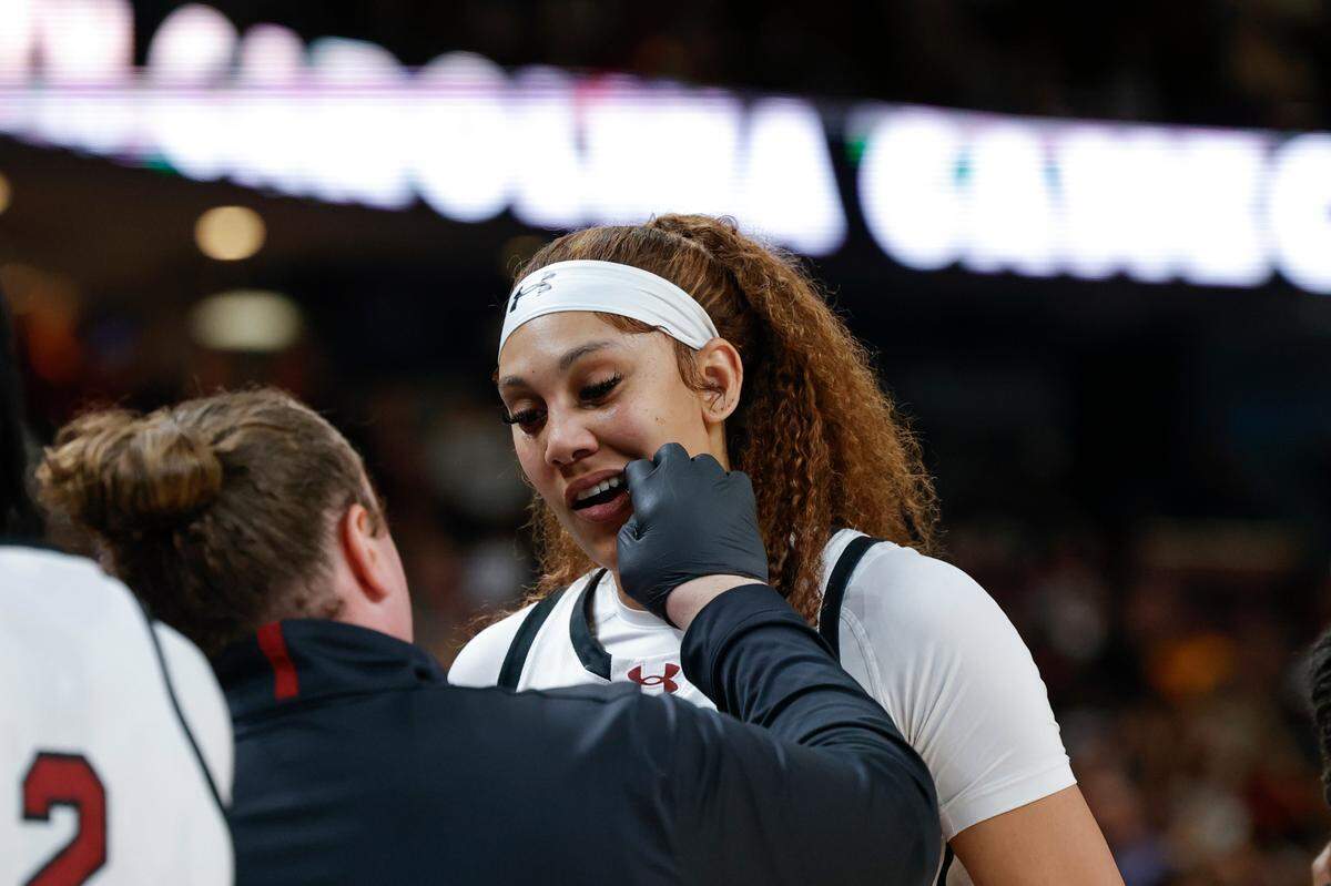South Carolina’s Kamilla Cardoso (10) is tended to in the aftermath of an altercation on court with LSU players during the second half of action in the SEC Tournament Championship game at Bon Secours Wellness Arena in Greenville on Sunday, Mar. 10, 2024.