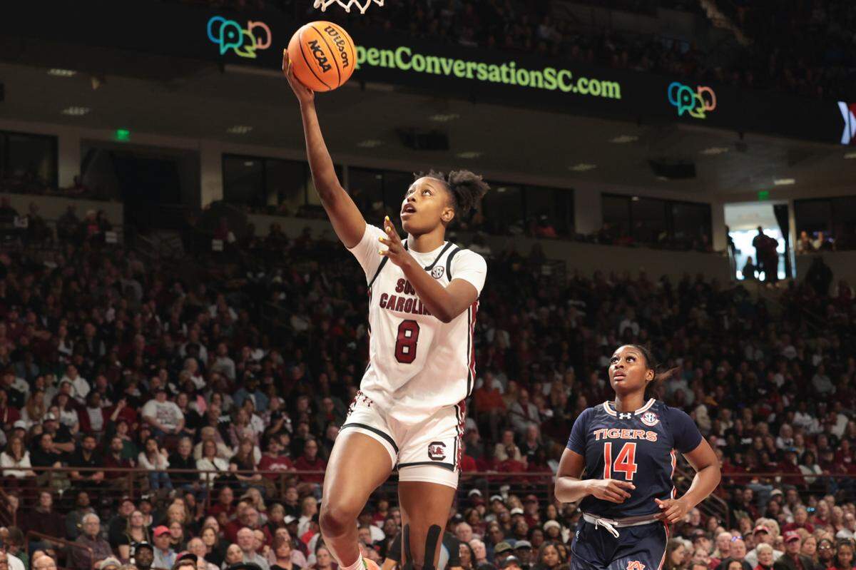 University of South Carolina’s Joyce Edwards (8) drives to the basket as Auburn’s Taylen Collins (14) follows during the first half of action in the Colonial Life Arena on Sunday, Feb. 2, 2025.