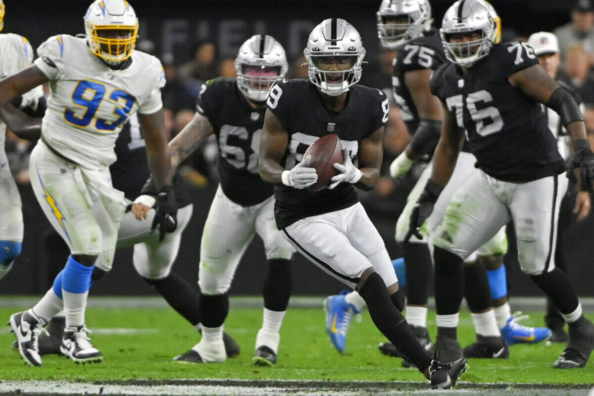 Las Vegas Raiders wide receiver Bryan Edwards (89) catches a pass against the Los Angeles Chargers during the first half of an NFL football game, Sunday, Jan. 9, 2022, in Las Vegas.