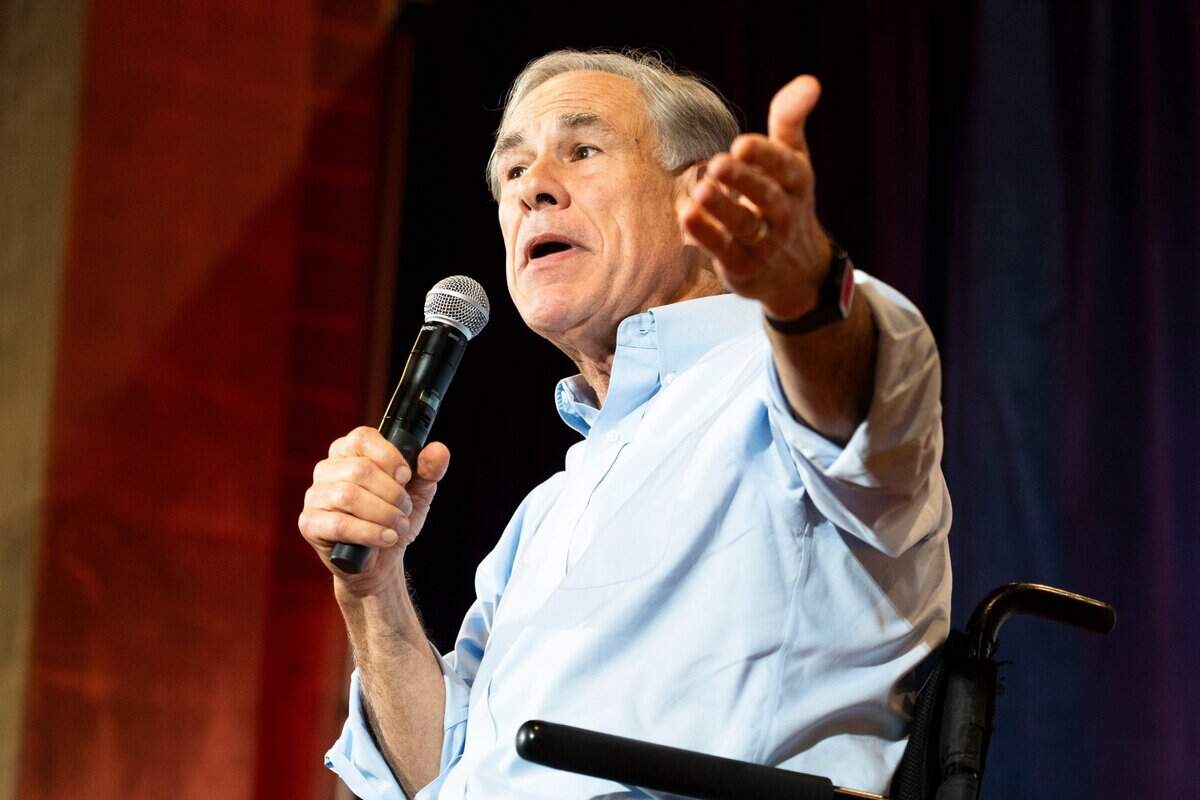 Texas Gov. Greg Abbott speaks during Iowa Gov. Kim Reynolds’ Harvest Festival fundraiser at Oman Family Youth Inn at the Iowa State Fairgrounds on Saturday, Oct. 5, 2024, in Des Moines.
