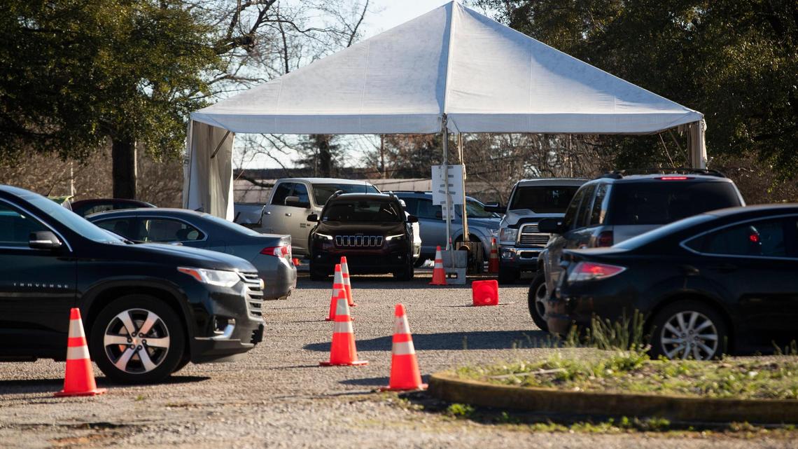 Dozens of people wait in their cars for coronavirus tests and vaccines at the Department of Health and Environmental Control on Tuesday, January 4, 2022.