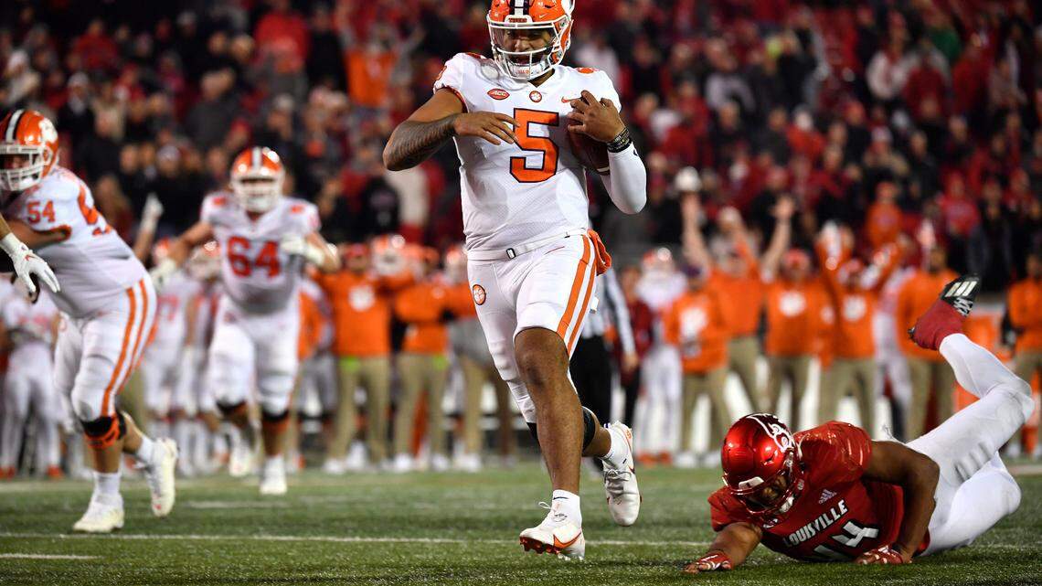 Louisville linebacker Dorian Jones (44) misses a tackle as Clemson quarterback D.J. Uiagalelei (5) scores the go-ahead touchdown Saturday at Louisville.