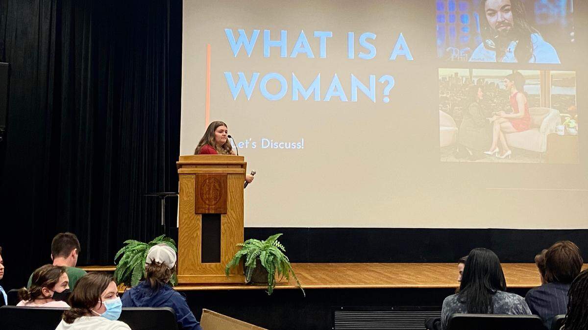 Emma Farrell, the president of the student chapter of Turning Point USA, moderates an event at the University of South Carolina that discussed transgender topics on March 23, 2023. Nearly 60 people showed up to protest.