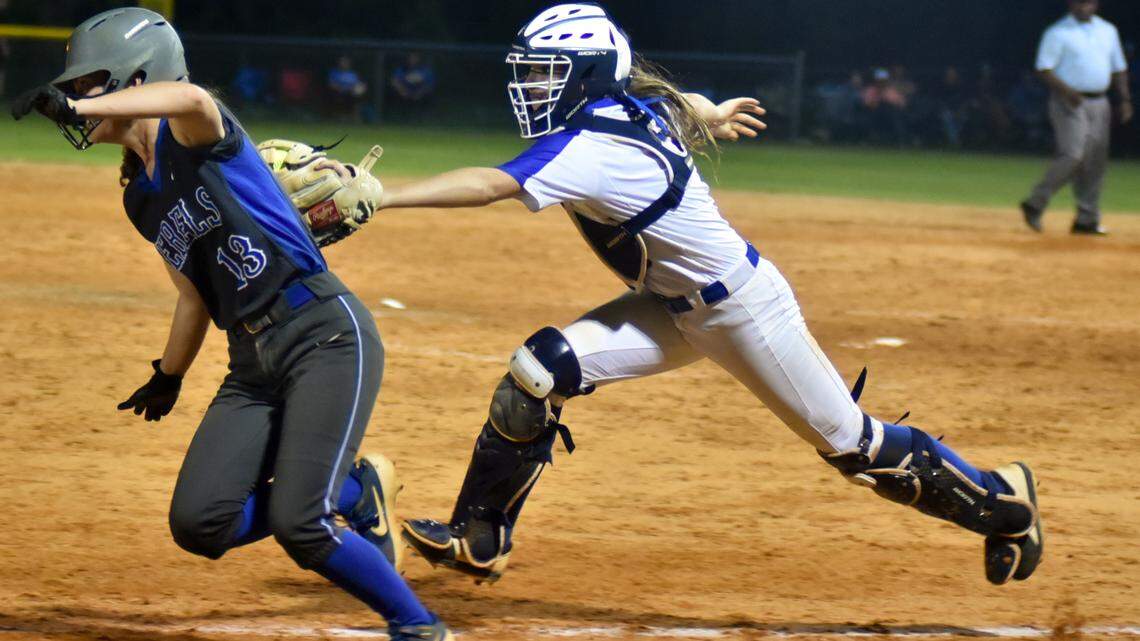 Lexington catcher Sarah Gordon tags out Laurin Nodine as she tried to return to third, ending the sixth inning Friday night. The Wildcats defeated the Byrnes Rebels 6-5 in Game 3 of the Class 5A softball championships May 17 in Rock Hill.