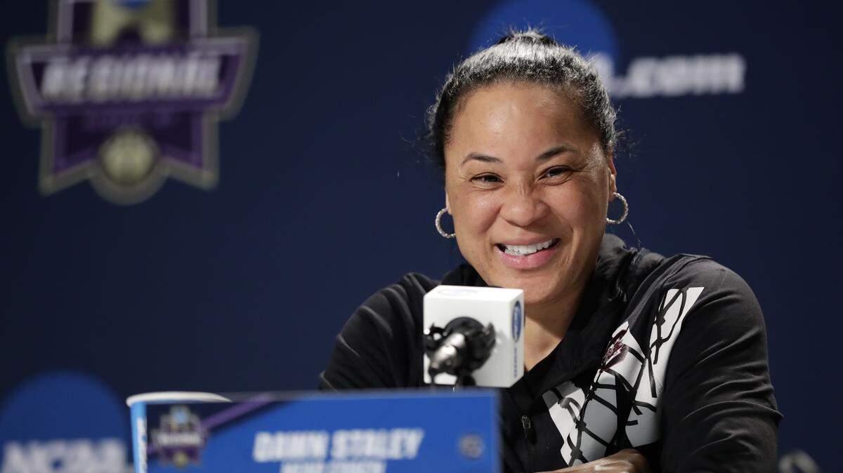 South Carolina head coach Dawn Staley smiles while speaking during a press conference before a regional semifinal game against Buffalo in the NCAA women's college basketball tournament Friday, March 23, 2018, in Albany, N.Y. South Carolina will play Buffalo on Saturday.