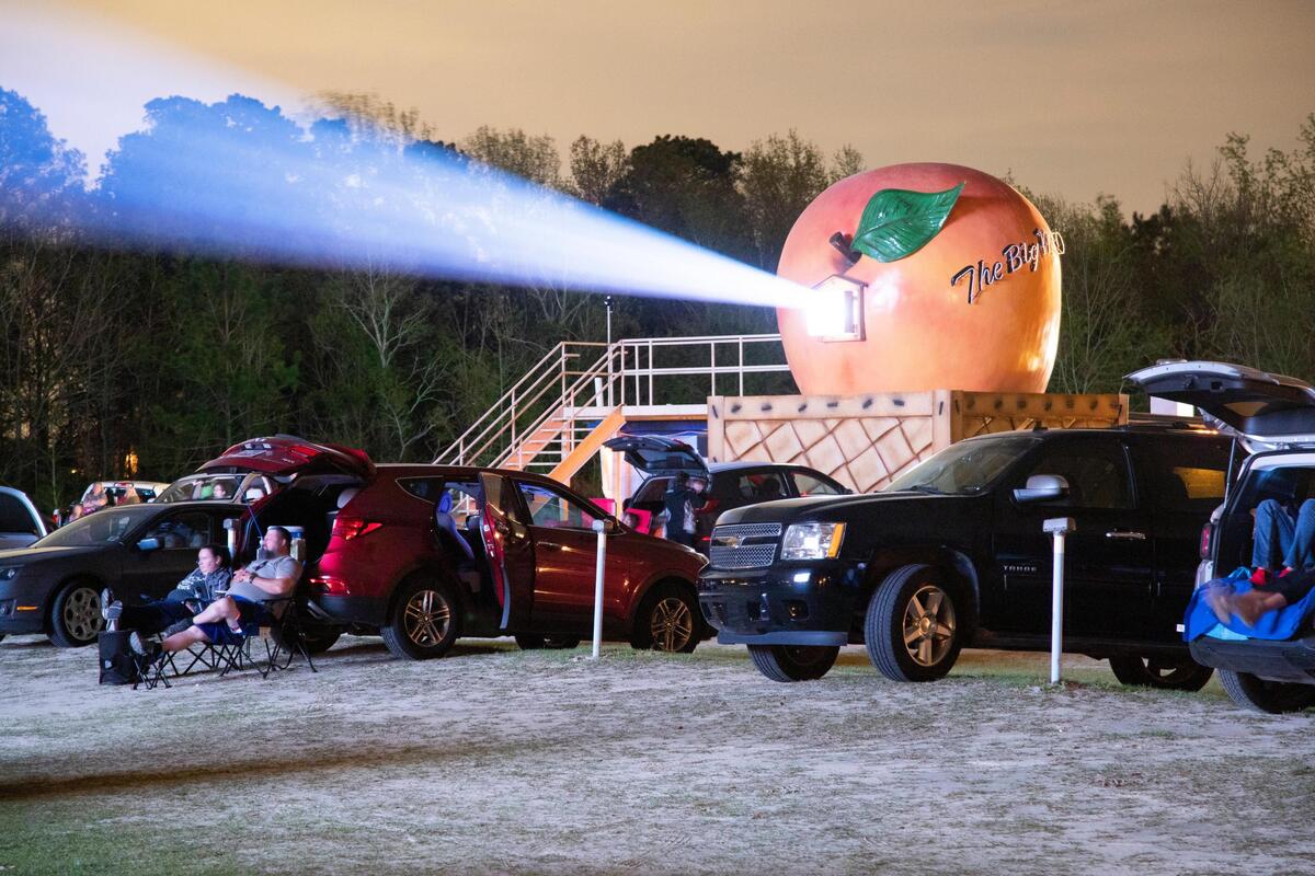 Families sit far apart from one another at the Monetta Drive-In on Friday, March 20, 2020. Health officials recommend being more than six feet away from other people in public to help stop the spread of the coronavirus.