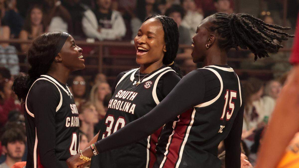University of South Carolina's Agot Makeer, (40), Maryam Dauda (30) and Adhel Tac (15) celebrate during GarNET & Black Madness on Tue., Oct. 21, 2025 at Colonial Life Arena.