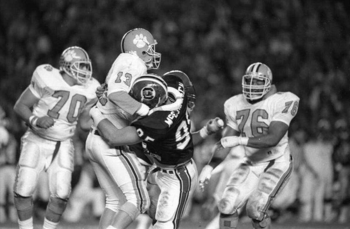 Clemson QB Rodney Williams takes a hit in the 1987 game against USC.