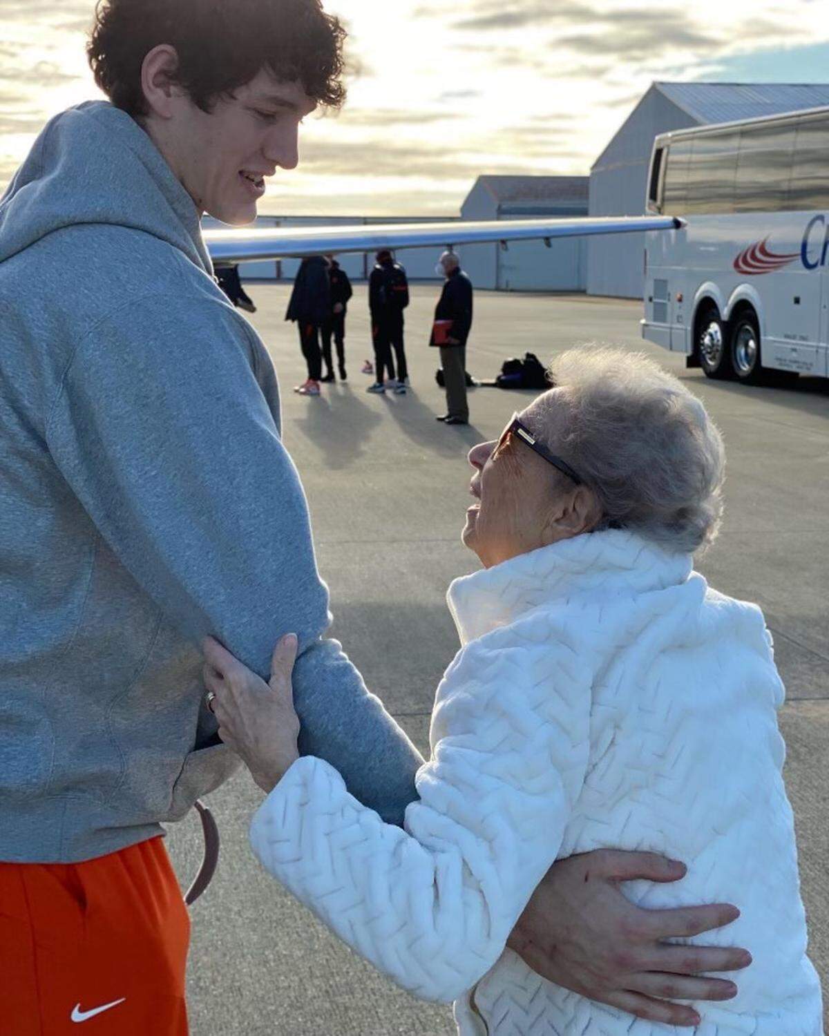 Paula Grooms gives Clemson center PJ Hall a hug prior to one of the Tigers’ road games. The Anderson resident has been seeing the team off and greeting them back from away games since the 2008-09 season.