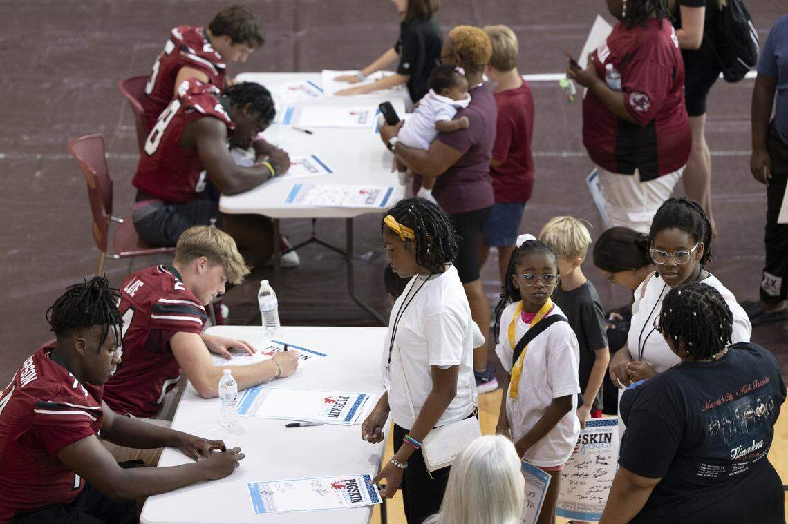 South Carolina football players sign autographs at the annual Pigskin Poets event held Friday, July 12, 2024 at Drew Wellness Center in Columbia.