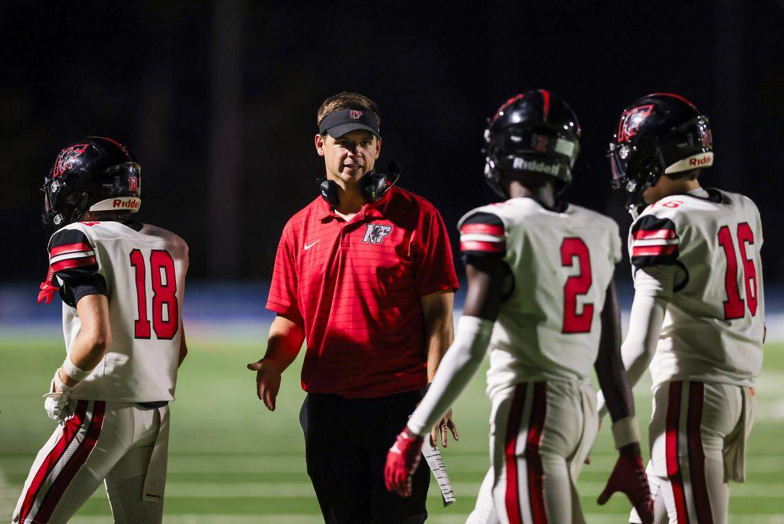 Nation Ford head coach Jake Bentley speaks with players during Richland Northeast’s game against Nation Ford in Columbia on Thursday, September 11, 2025.