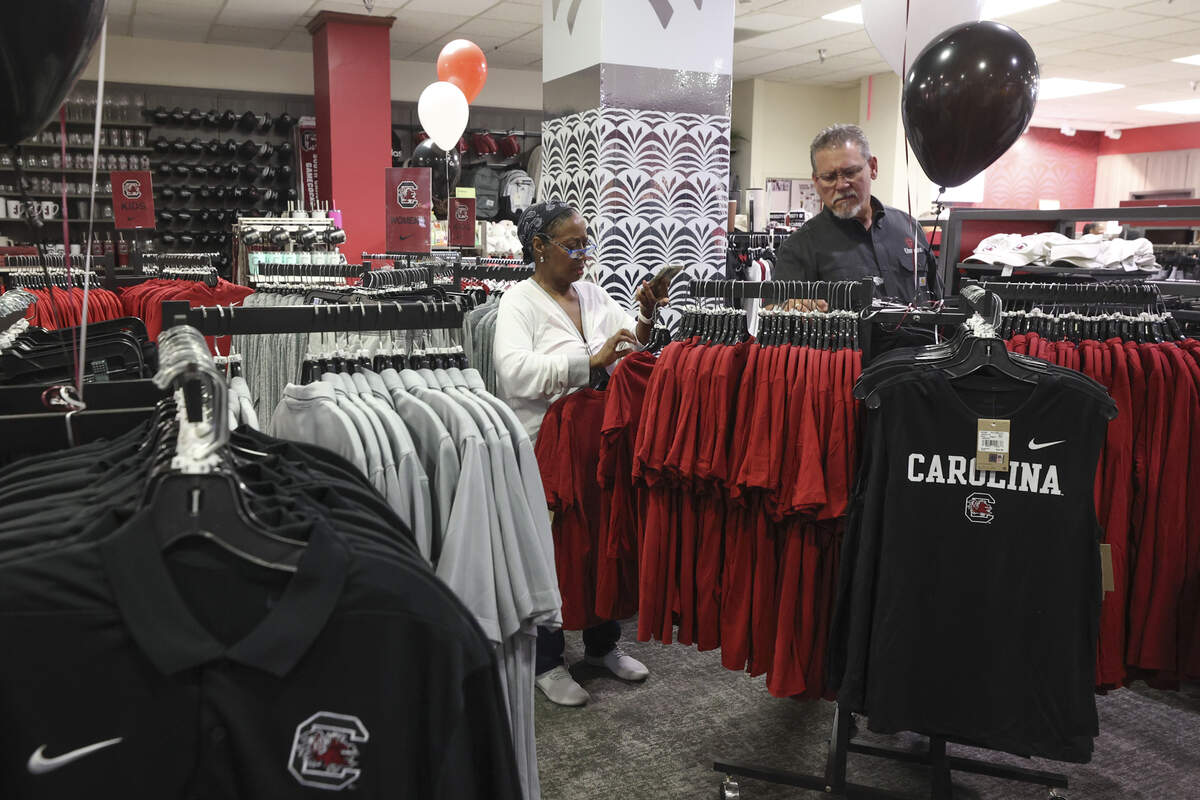 Dorothy Ham-Kisteneff and Gene Henderson were among the first to shop for Nike logo Gamecock apparel at the USC Campus Store at the Russell House on Wednesday, July 1, 2026.