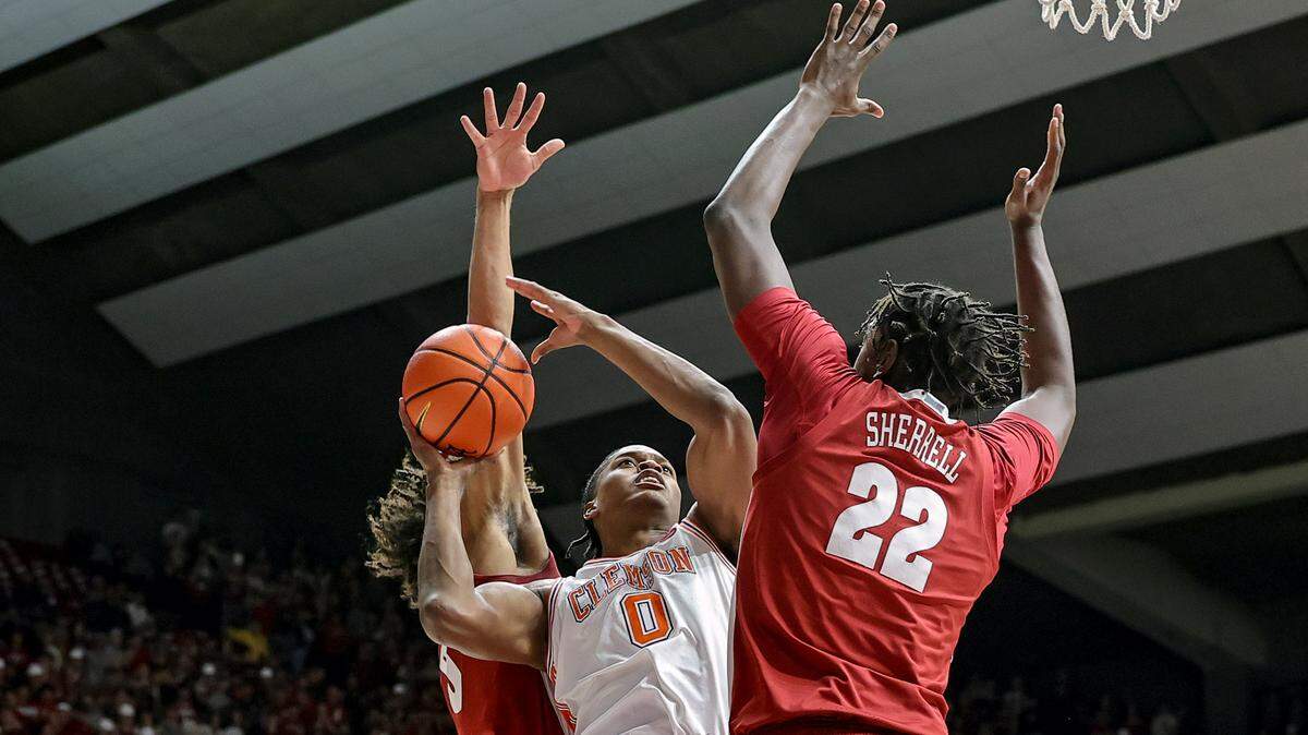TUSCALOOSA, ALABAMA - DECEMBER 3: RJ Godfrey #0 of the Clemson Tigers drives to the basket during the first half between Amari Allen #5 and Aiden Sherrell #22 of the Alabama Crimson Tide at Coleman Coliseum on December 3, 2025 in Tuscaloosa, Alabama.