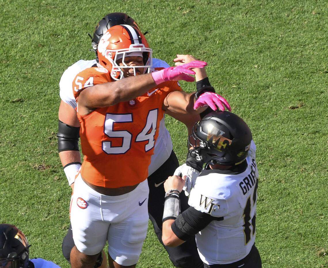 Oct 7, 2023; Clemson, South Carolina, USA; Clemson linebacker Jeremiah Trotter Jr. (54) pressures Wake Forest quarterback Mitch Griffis (12) during the first quarter at Memorial Stadium. Mandatory Credit: Ken Ruinard-USA TODAY Sports