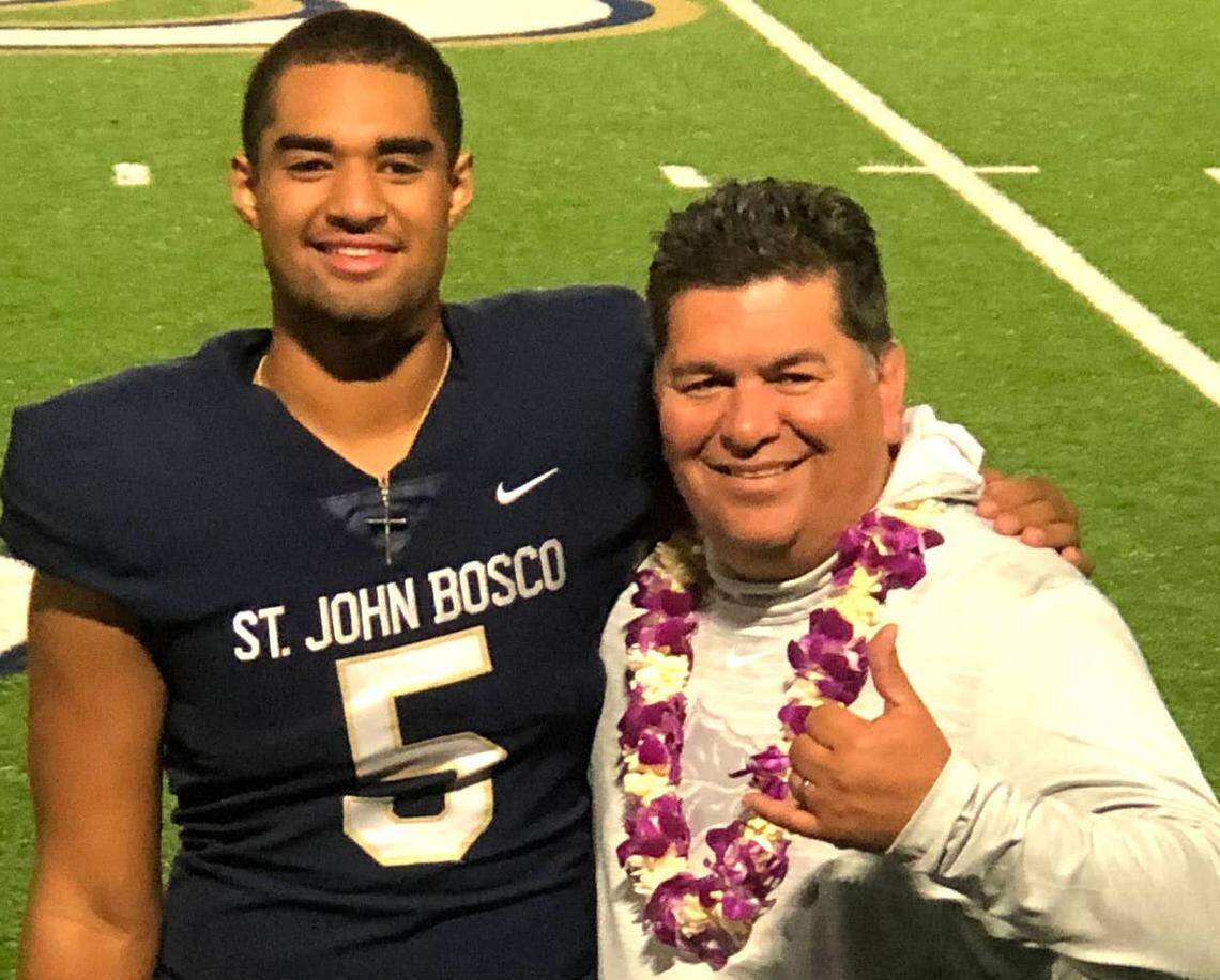 D.J. Uiagalelei pictured with St. John Bosco defensive line coach Paul Diaz following a Braves football game.