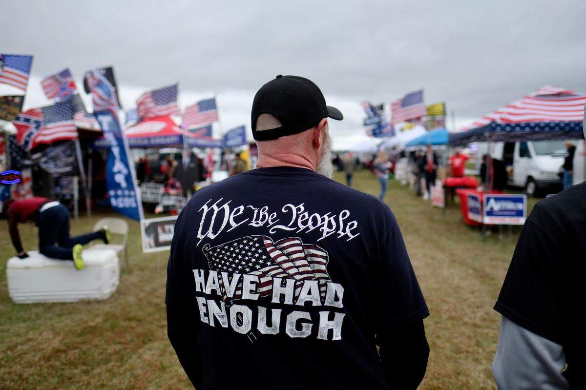 Supporters gather hours ahead of former President Donald Trump’s rally in Florence, S.C., on Saturday, March 12, 2022.