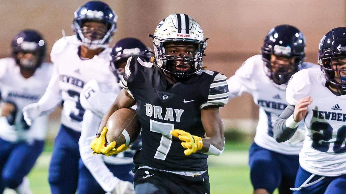 Gray Collegiate War Eagles Devin Johnson (7) returns the games opening kickoff for a touchdown against the Newberry Bulldogs in a playoff game Friday, Nov. 26, 2021 at Fairfield Central High School.