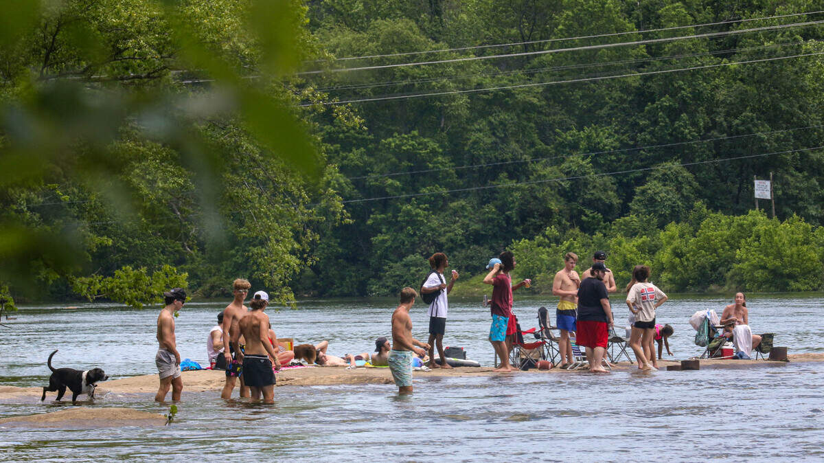 People hang out at the Saluda River on May 4, 2020.