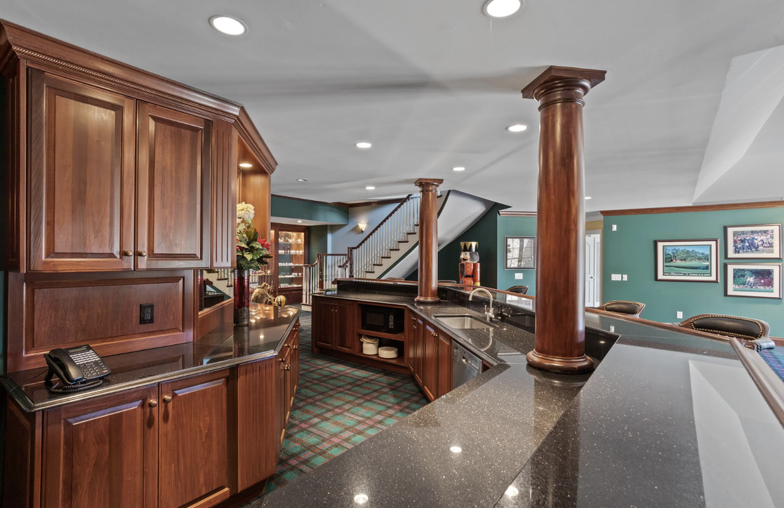 The chef’s kitchen includes two islands and high-end appliances.