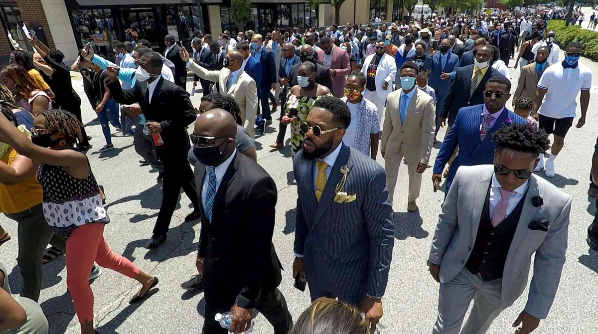 People march down Harden Street during the Million Man March in Columbia. Participants marched from Martin Luther King Park to the South Carolina State House. 6/14/20