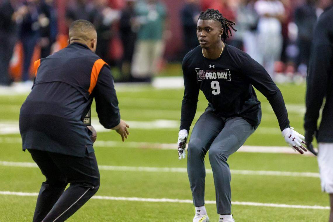 South Carolina Gamecocks defensive back Cam Smith (9) listens to instruction from a Bengals scout during USC Pro Day March 13, 2023.