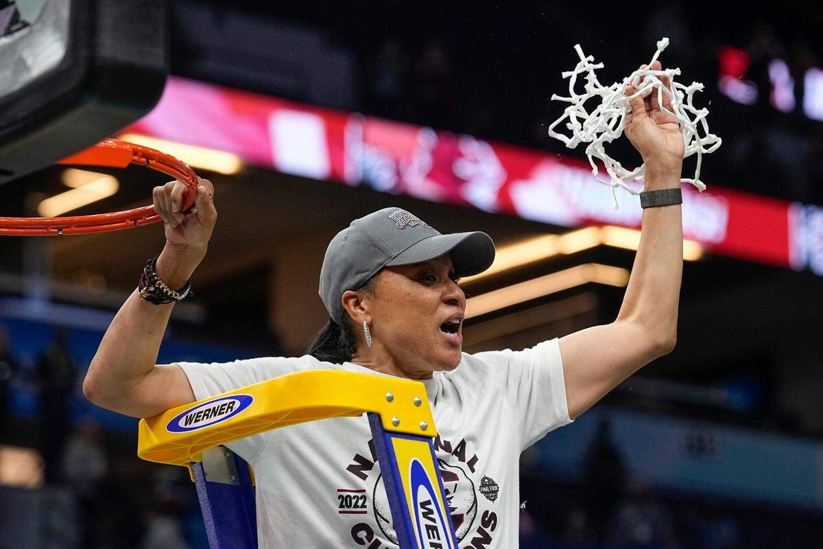 South Carolina head coach Dawn Staley cuts down the net after a college basketball game in the final round of the Women’s Final Four NCAA tournament against UConn Sunday, April 3, 2022, in Minneapolis. South Carolina won 64-49 to win the championship. (AP Photo/Eric Gay)