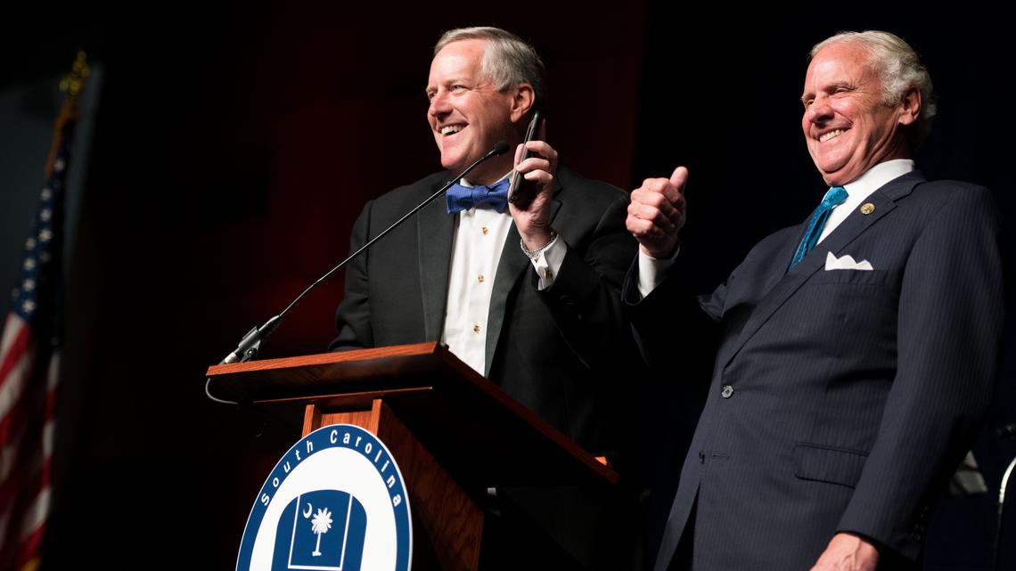 Rep. Mark Meadows, R-N.C., left, interrupts S.C. Gov. Henry McMaster with a phone call from President Donald Trump during the 51st annual Silver Elephant Gala on Friday at the Columbia Metro Convention Center.