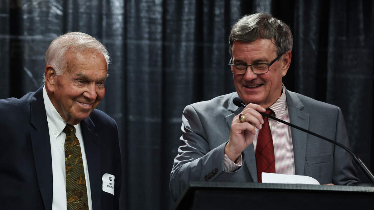 From Oct. 12, Tommy Moody, right, laughs while introducing former Bobby Richardson for a special recognition during the USC Hall of Fame induction ceremony in Columbia.