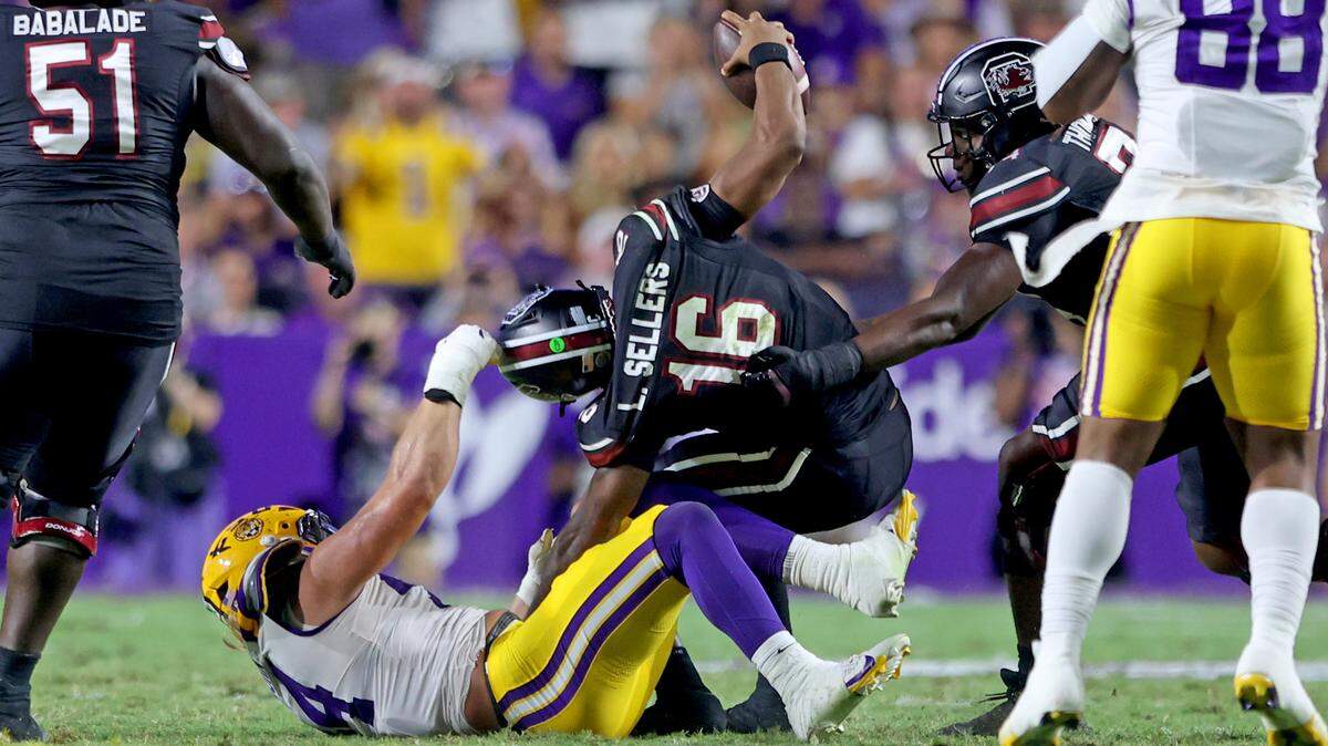 Defensive end Jack Pyburn #44 of the Louisiana State Tigers sacks quarterback Lanorris Sellers #16 of the South Carolina Gamecocks for a 9-yard loss in the second quarter at Tiger Stadium on October 11, 2025 in Baton Rouge, Louisiana.