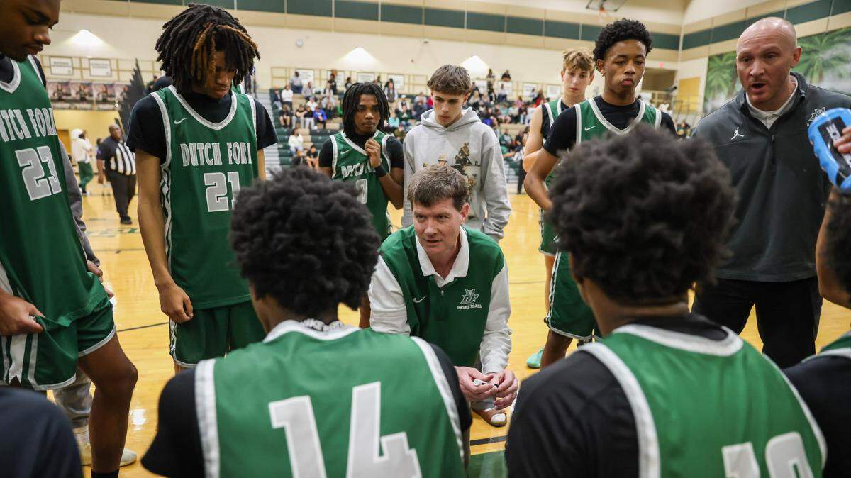 Dutch Fork head coach Bret Jones speaks to his players during the game against River Bluff at River Bluff High School on Tuesday, January 28, 2025.
