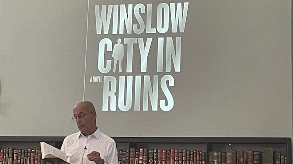 Crime novelist Don Winslow reads from his new book, “City in Ruins,” at the Charleston Library Society on April 23, 2024.
