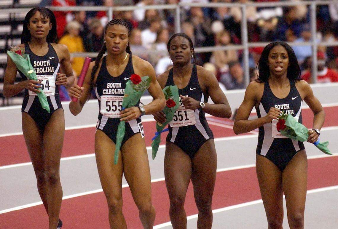 From March 2002: South Carolina’s (from left) Shevon Stoddart, Demetria Washington, Tacita Bass and LeShinda Demus take a victory lap after winning the 4x400 relay during the NCAA Indoor Track and Field Championships in Fayetteville, Arkansas.
