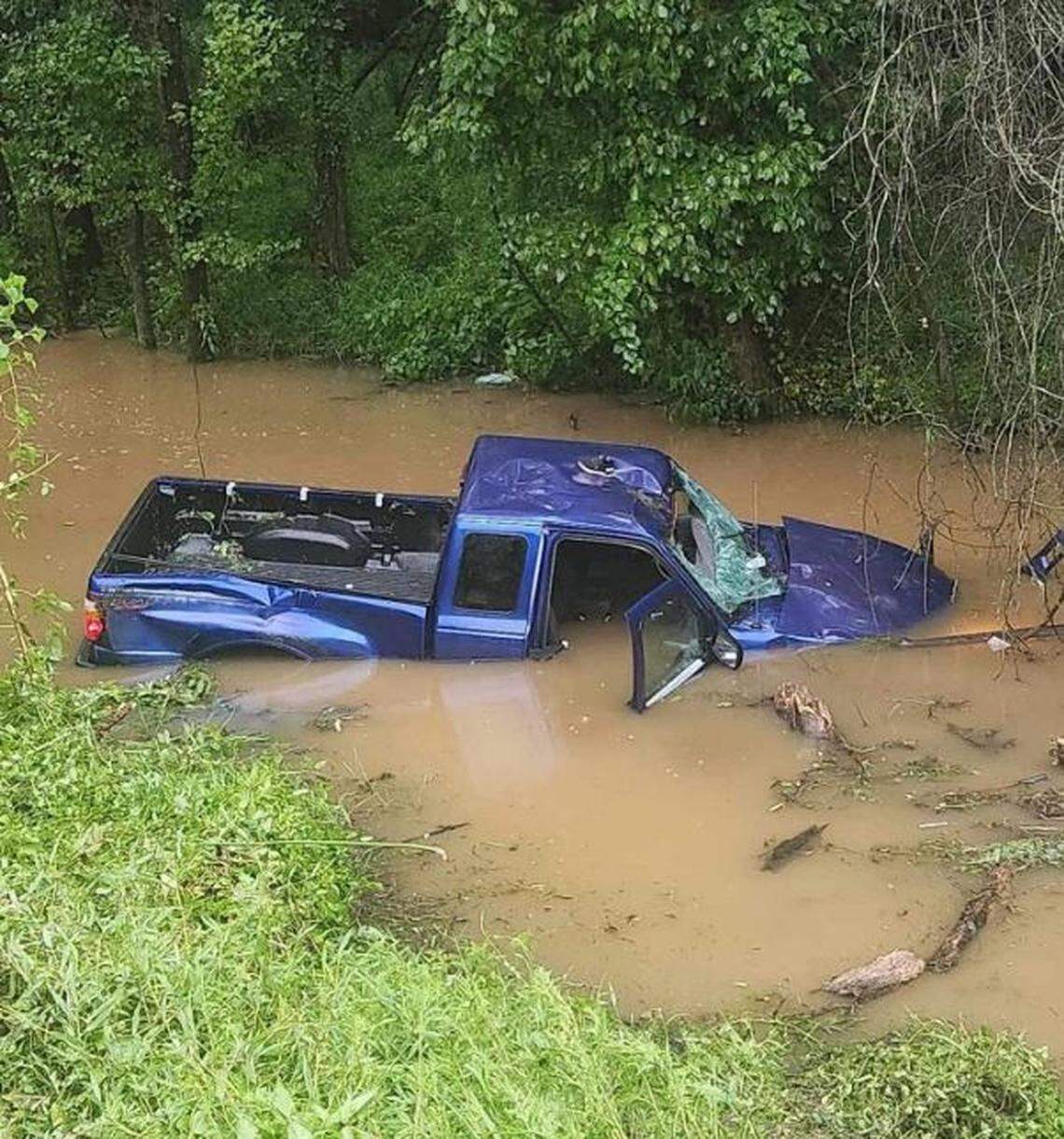 A truck ended up in a creek after going down an embankment, the Columbia Fire Department said.