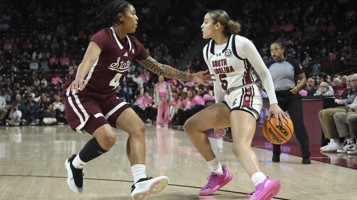 South Carolina's Tessa Johnson (5) dribbles around Mississippi State's Trayanna Crisp (4) during the first half of action of their women's basketball game against Ole Miss at Colonial Life Arena on Thursday, Feb. 5, 2026.