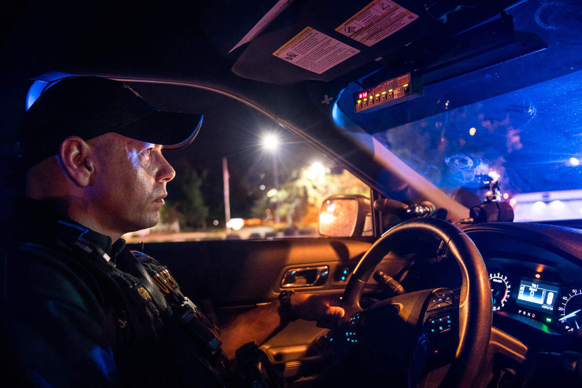 Kershaw County Sheriff’s deputy Jarrett Greenway drives past a traffic stop on Friday night, Aug. 17, 2018, in Camden, S.C. Greenway is an award-winning DUI traffic cop.