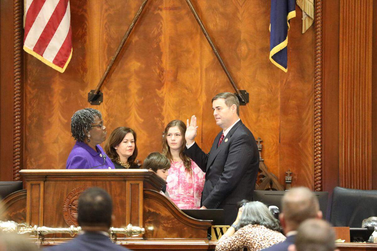 South Carolina Republican House Speaker Murrell Smith, right, takes his oath of officer from Democratic Rep. Gilda Cobb-Hunter of Orangeburg on Tuesday, Dec. 6, 2022, in the House chambers in Columbia, South Carolina. (AP Photo/Jeffrey Collins)