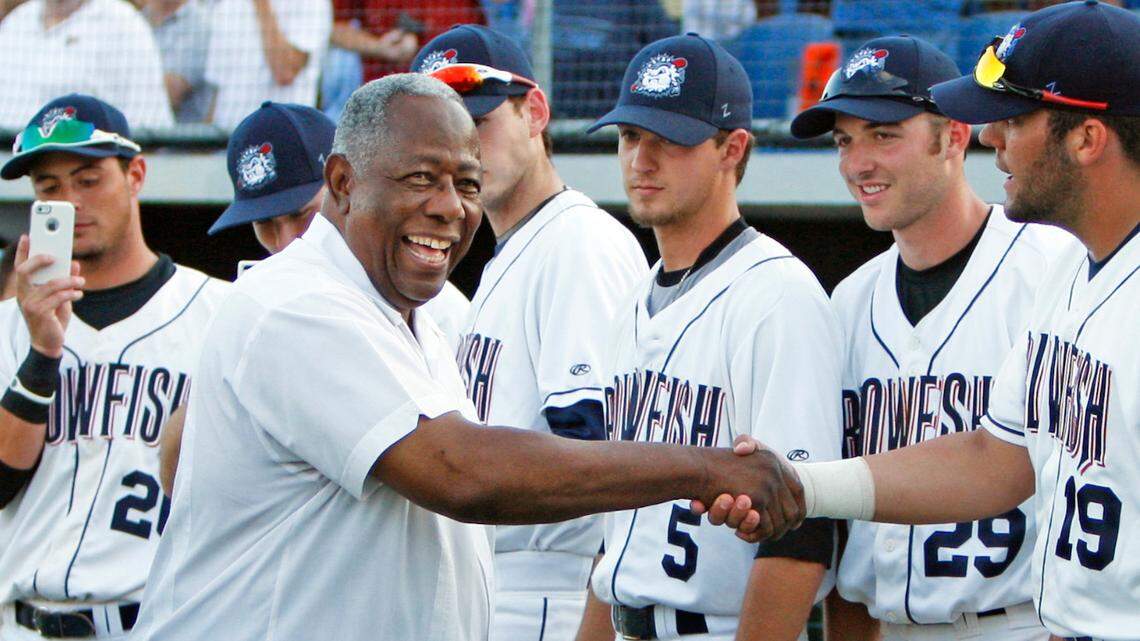 Hank Aaron meets the Blowfish baseball team before a 2013 game at the Capital City Stadium. The Atlanta Braves great threw out the ceremonial first pitch that day and talked with fans. Aaron played in Columbia in 1953 when he was in the minor leagues playing for Jacksonville.