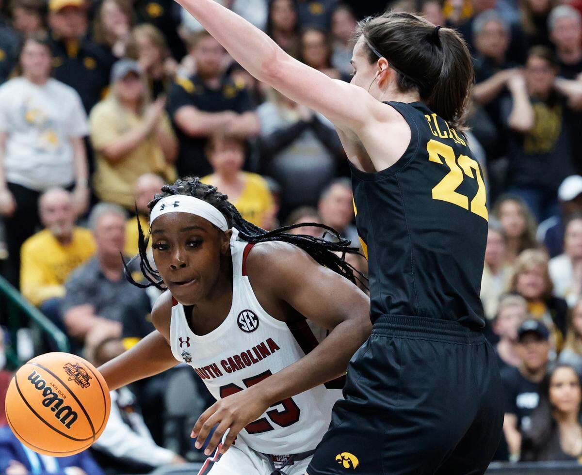 South Carolina guard Raven Johnson (25) drives against Iowa’s Caitlyn Clark in the 2023 NCAA Tournament Final Four.