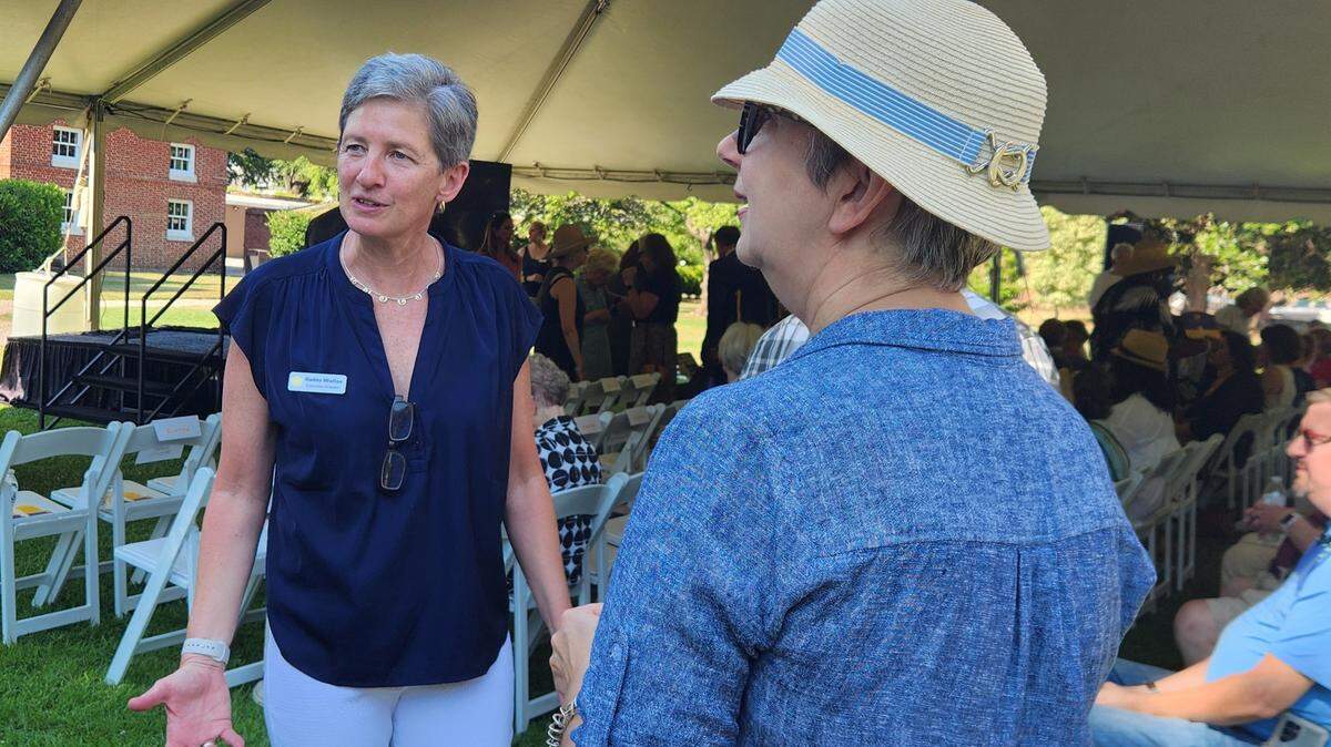 Robin Waites, left, chats with friends on Tuesday, June 25, 2024 before a ceremony celebrating her legacy. Waites is retiring as the longtime executive director of Historic Columbia.