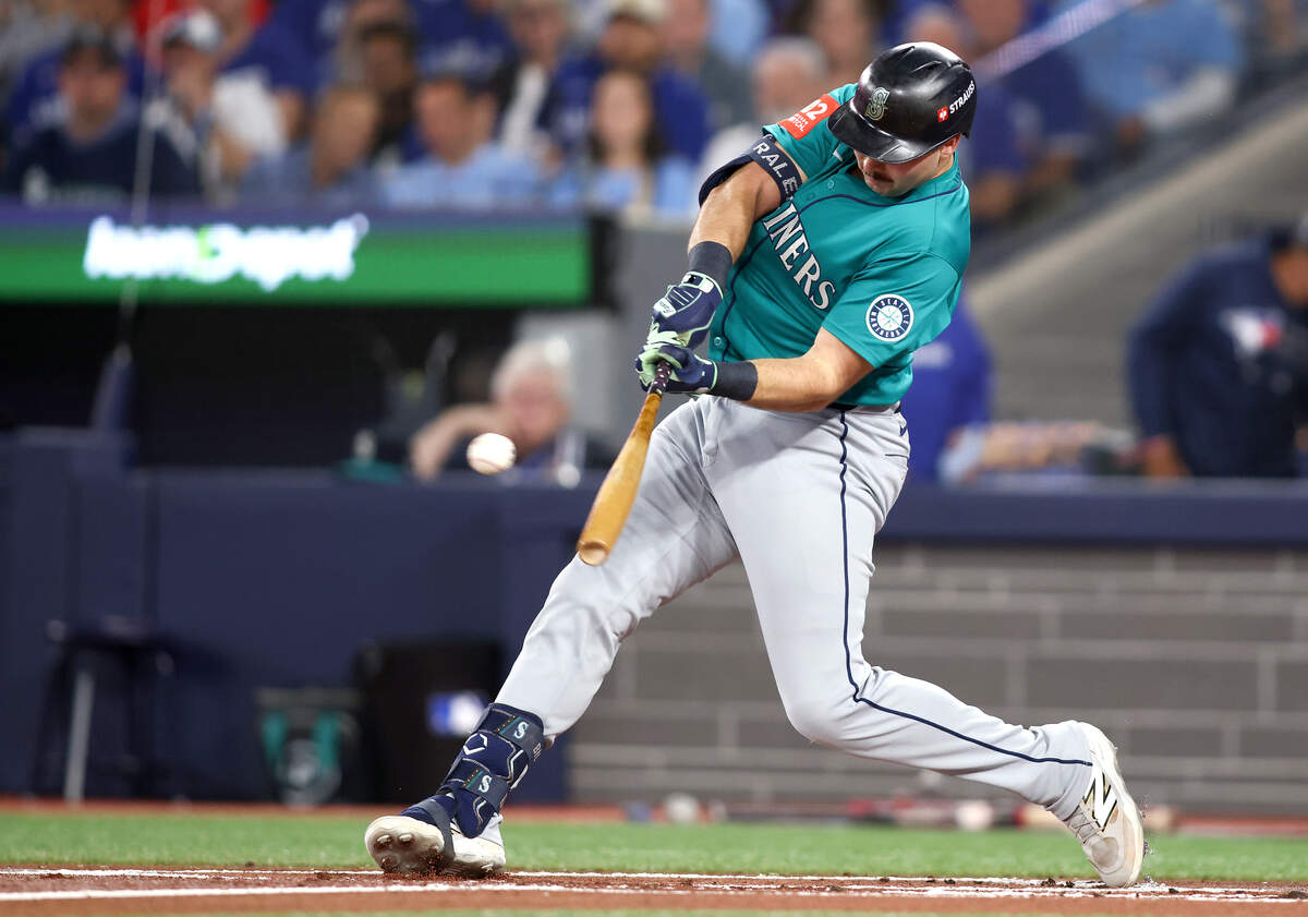 Cal Raleigh of the Seattle Mariners hits a single against the Toronto Blue Jays during the first inning in Game 1 of the American League Championship Series at Toronto’s Rogers Centre on Oct. 12, 2025.