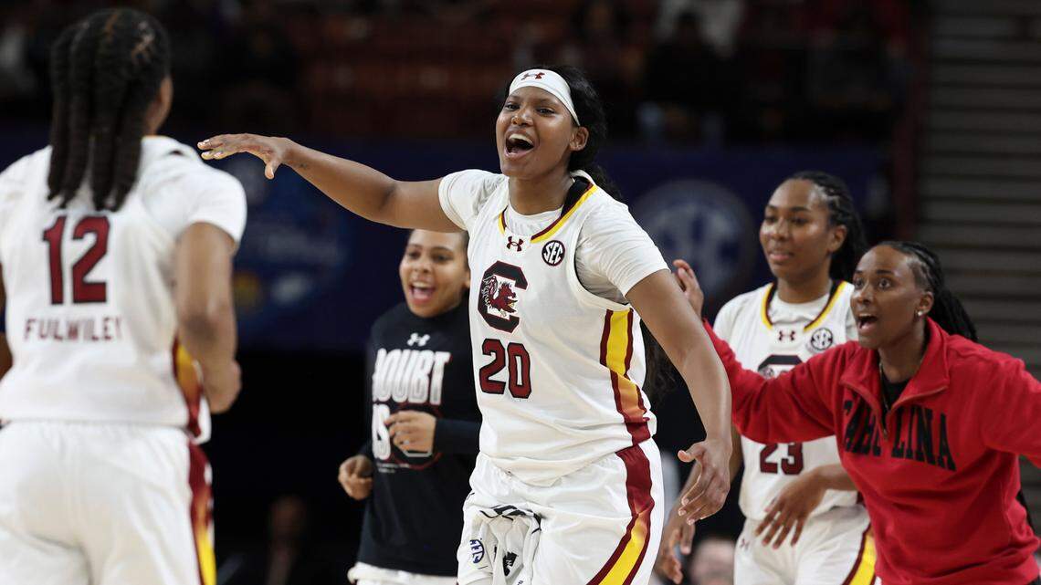 University of South Carolina’s Sania Feagin (20) and University of South Carolina Assistant Coach Khadijah Sessions cheer on University of South Carolina’s MiLaysia Fulwiley (12) during the first half of action in the SEC Tournament at the Bon Secours Wellness Arena in Greenville on Saturday, March 8, 2025.