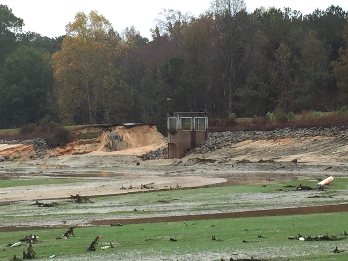 The crumbled Semmes Lake dam at Fort Jackson broke during an October 2015 flood, sending water rushing toward homes and businesses downstream.