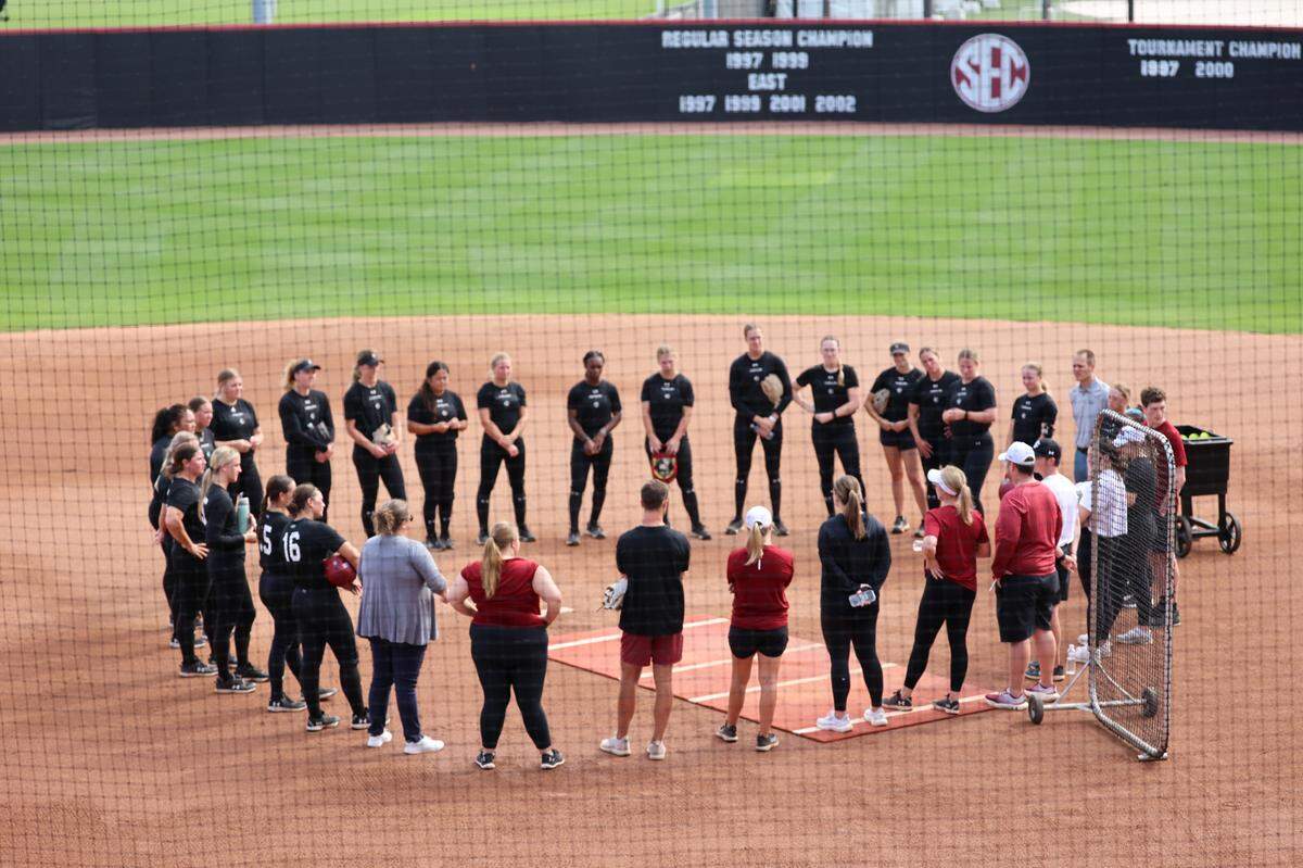 The University of South Carolina softball coach Ashley Chastain Woodard talks with the team after practice at the Carolina Softball Stadium before the NCAA Columbia Regional on Thursday, May, 15, 2025.