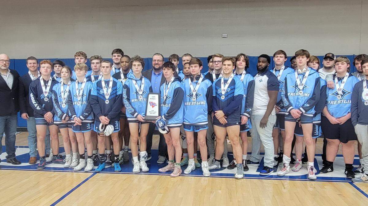 Aynor poses the runner-up trophy after Saturday’s Class 3A wrestling championship.