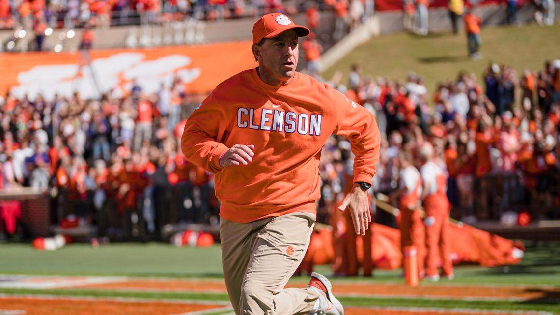 Clemson head coach Dabo Swinney runs onto the field before an NCAA college football game against Syracuse on Saturday, Oct. 22, 2022, in Clemson, S.C. (AP Photo/Jacob Kupferman)